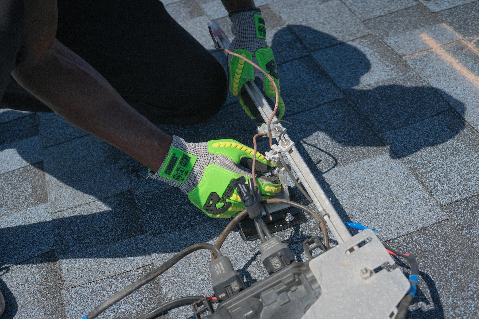A close-up of high-quality architectural asphalt shingles installed with precision flashing around a chimney on a Murray home.