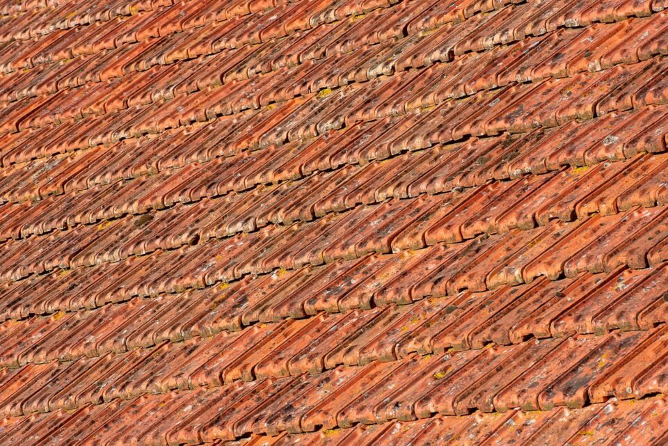 A large commercial facility near 324 S 400 W in Salt Lake City featuring a premium clay tile roof under a clear Utah sky.