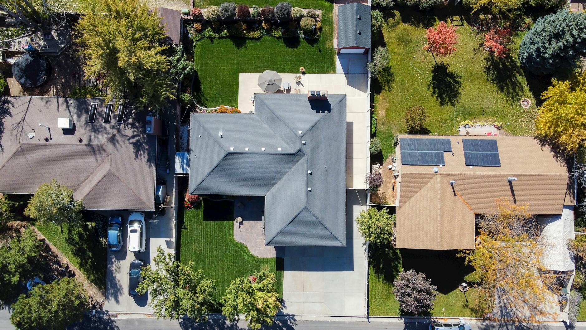 A professional roofing crew carefully installing underlayment on a residential home in West Jordan, Utah.